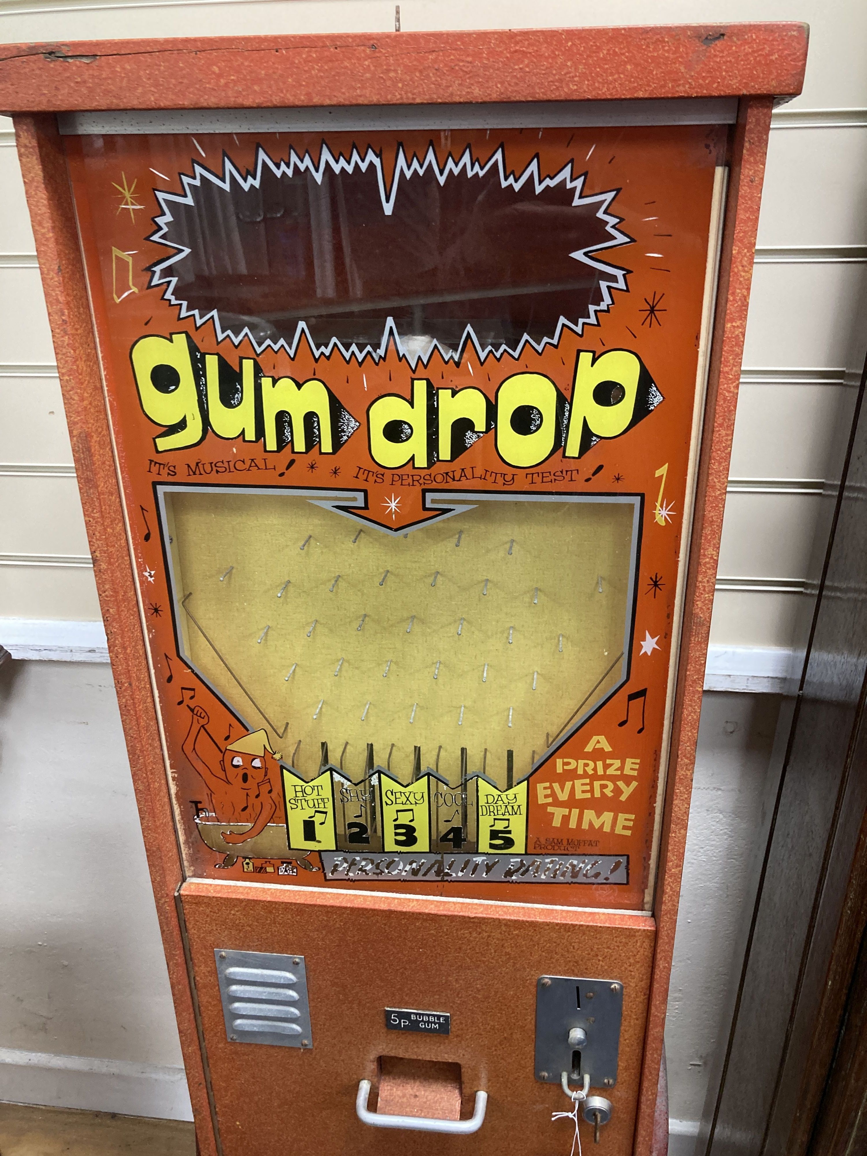 A novelty 20th century gum drop musical personality test arcade machine, width 38cm, depth 28cm, height 137cm